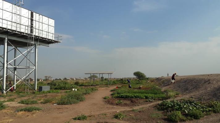 Crops are now being grown on the side of the dam built by WFP. A water storage tank was also built by WFP for the residents. Crops are now being grown on the side of the dam built by WFP. A water storage tank was also built by WFP for the residents.
