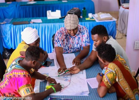 Participants interact and discuss the regeneration strategies in Kakuma, facilitated by UN-Habitat. © Thabit Photograp