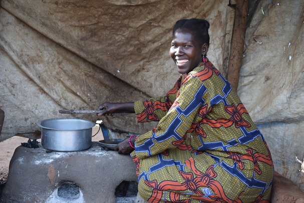 A South Sudanese woman refugee cooking in Uganda