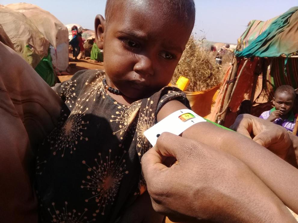 Nafisa having a MUAC follow up monitoring at her home in Hanano Incubator Location