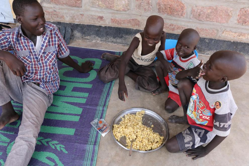 young_refugees_from_south_sudan_enjoy_a_wfp-provided_meal._courtesy_wfp.jpg