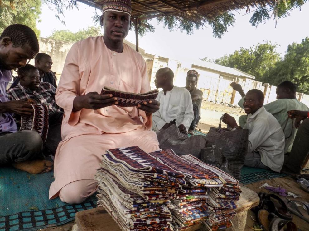 With support from the EU trust fund and NRC, Modu makes and sells caps to cater for his family in Maiduguri.