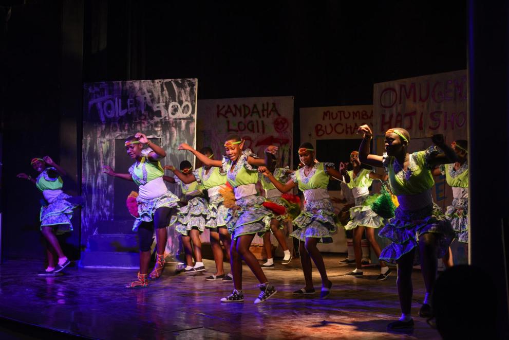 Students perform cultural dances during the competition at the national theater.