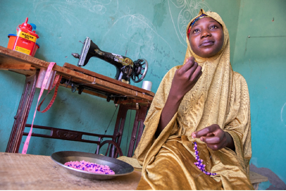 With the income from her sewing and jewelry-making businesses, Ummaima supports her family.