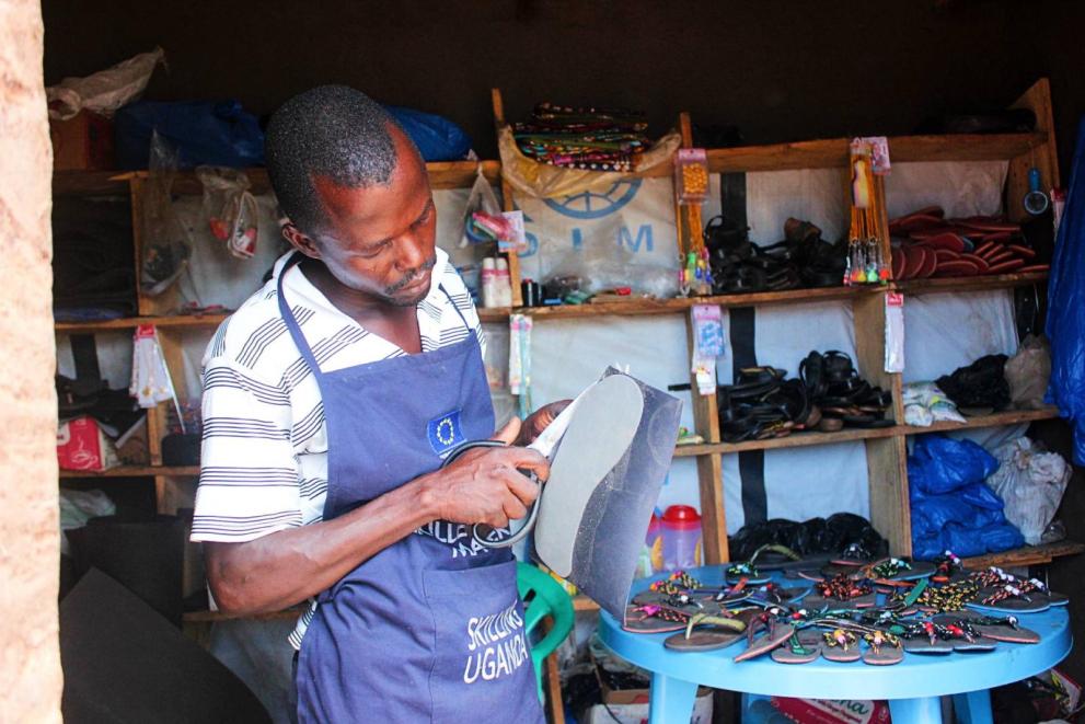 Thanks to a sandal-making training, Emmanuel Logworong turned his small retail shop into a successful sandal-making workshop