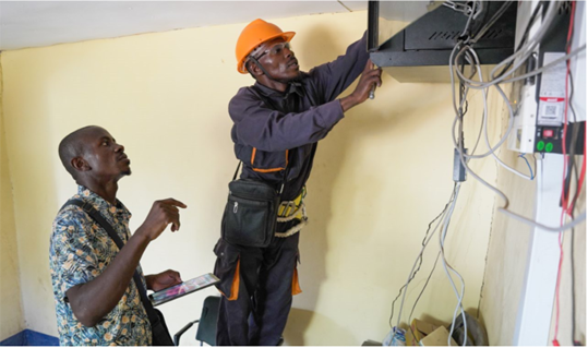) Wicomnet Solutions co-founders Fabrice Kitala Mupenge and Olivier Itulabwami Olivier Itulabwani makes repairs