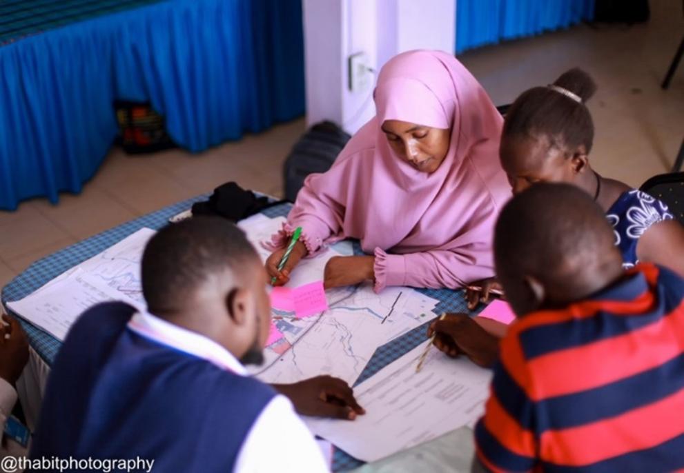 Participants interact and discuss the regeneration strategies in Kakuma, facilitated by UN-Habitat. © Thabit Photograpy