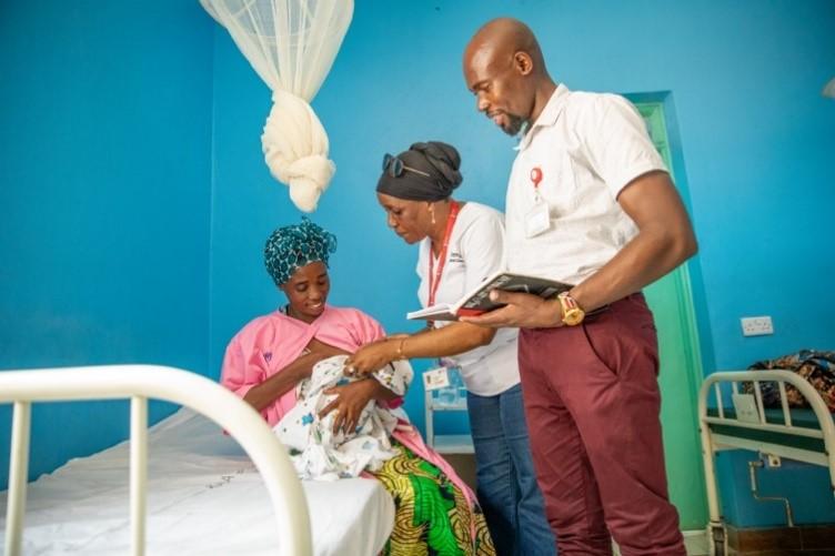 Asha Amber and Amos Nabwela checking in on Buchumi’s baby light at the maternity wing of the Natukobenyo Health Center