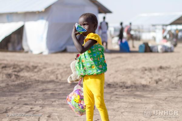unhcr_a_girl_enjoying_a_packet_of_milk_bought_in_kalobeyei_using_bamba_chakula.jpg