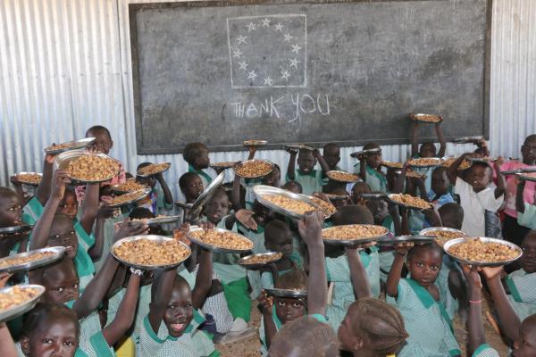 Children enjoying their school meal in Kalobeyei settlement primary school
