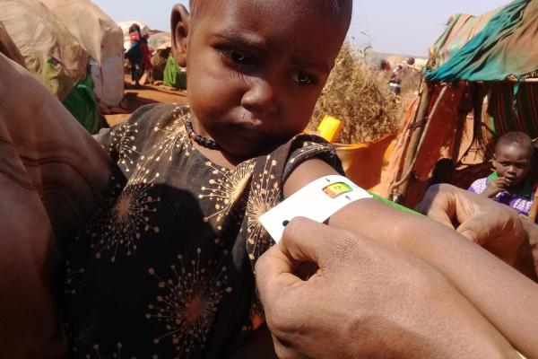 Nafisa having a MUAC follow up monitoring at her home in Hanano Incubator Location