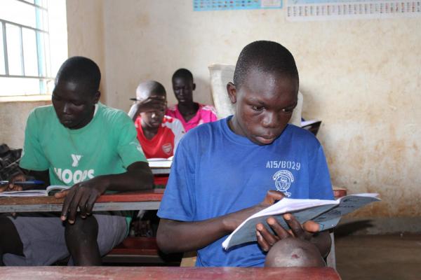17-year old John-Thomas Gama in his classroom in Uganda