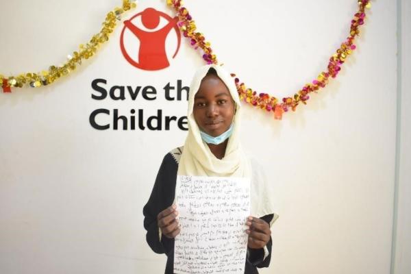 A child proudly shows her recommendations